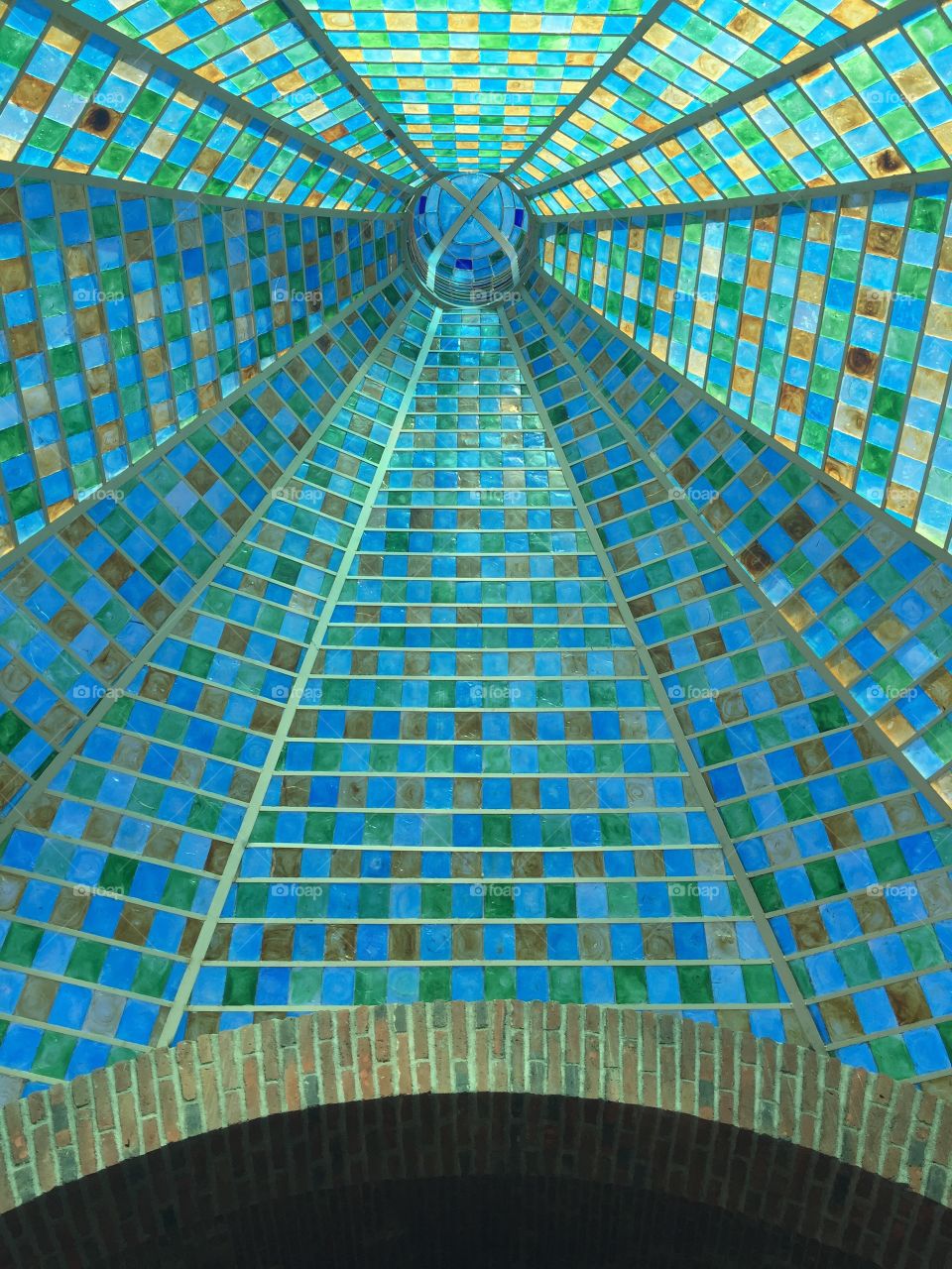 Stunning blue, green and yellow glass pointy ceiling in a glass shop in Cabo San Lucas in the Mexican Riviera