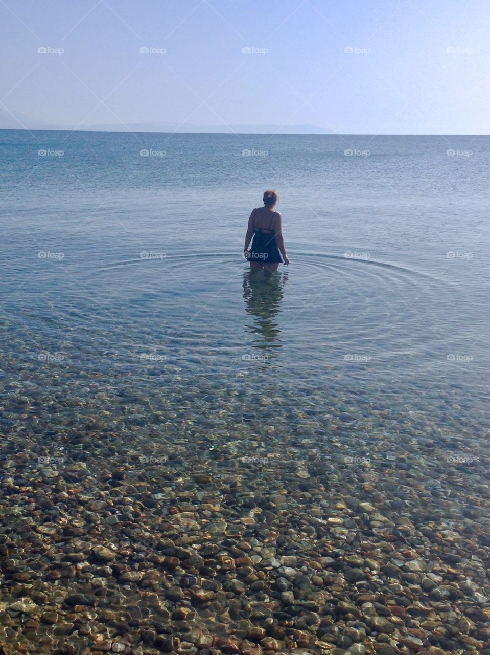 Silhouette of woman in the water