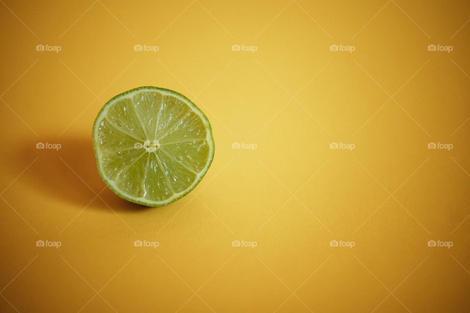 Lime on Yellow Background