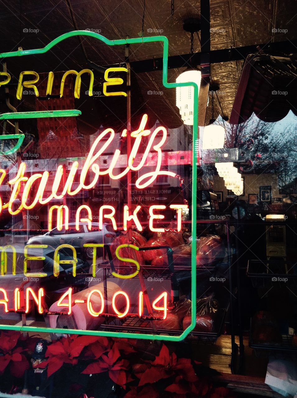 Neon reflection. Vintage neon sign reflects through a street window in New York City