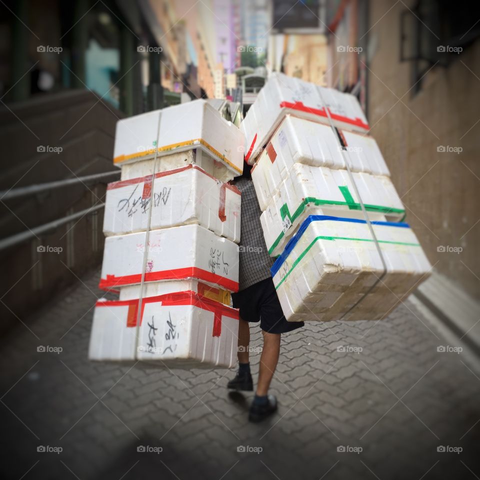 Man carrying styrofoam boxes