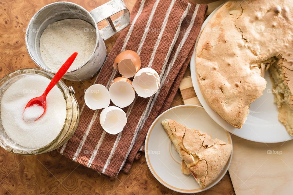 Making homemade puffed apple pie with eggs, sugar and flour.