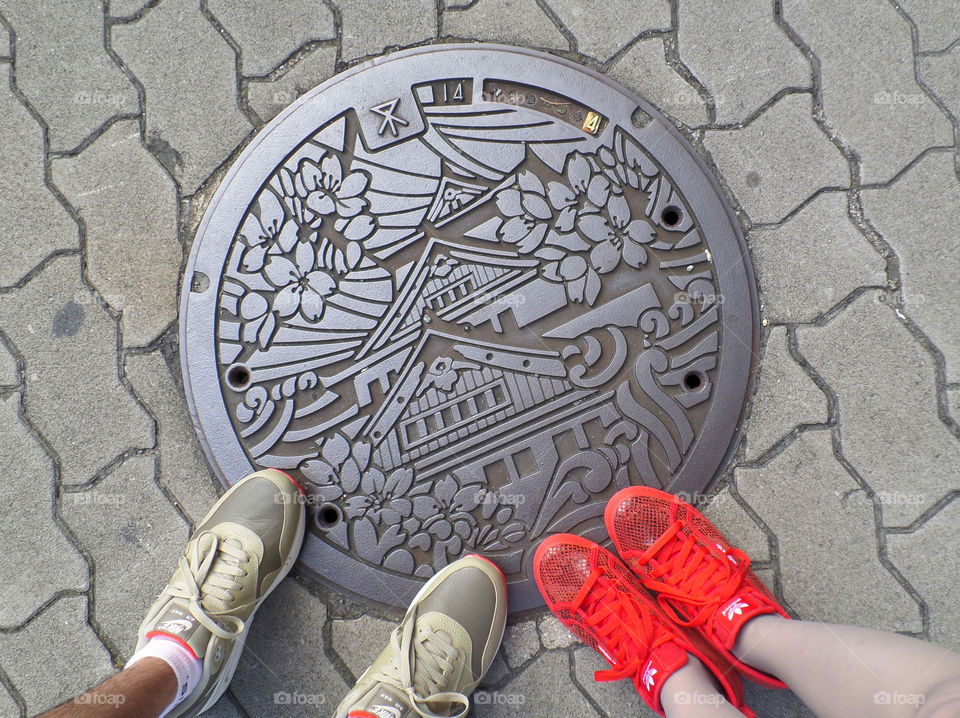 On the stunning manhole cover in the city centre of Osaka, Japan