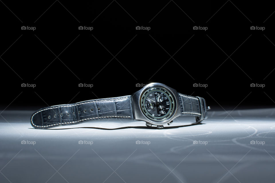 modern handwatch on the table. Men's wristwatch