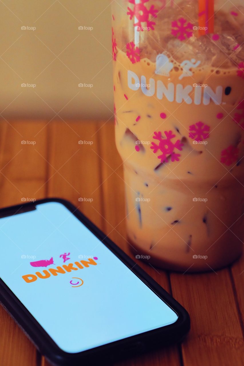 Dunkin Donuts Iced Coffee with iPhone App, Relxing with coffee, coffee app on phone, phone with coffee, relaxing in the morning 