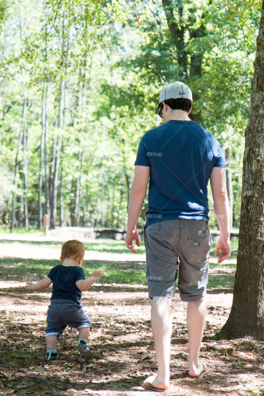 Watching his first steps 