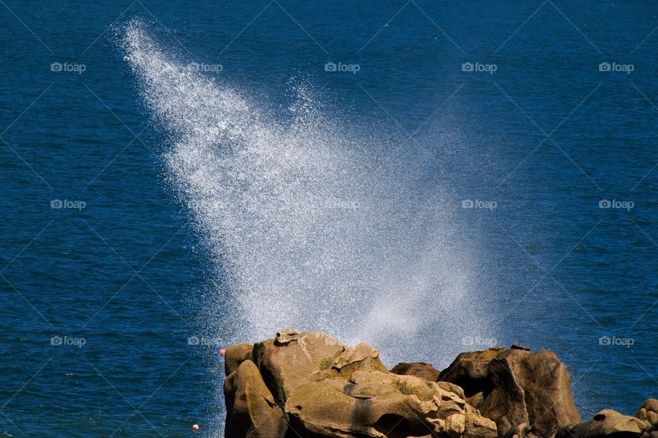 waves breaking on rocks