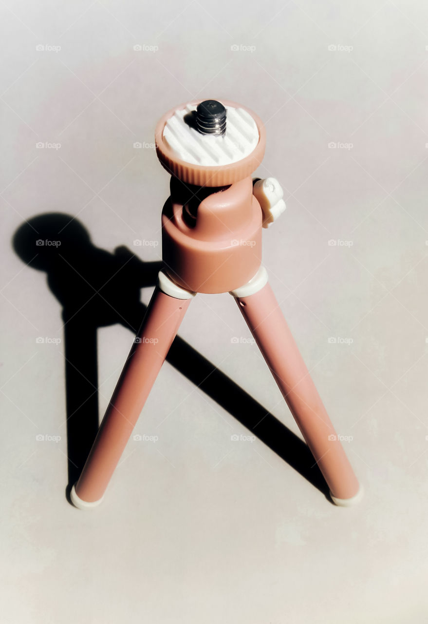 Mini Tripod for Mobile Phone Camera pink color white background