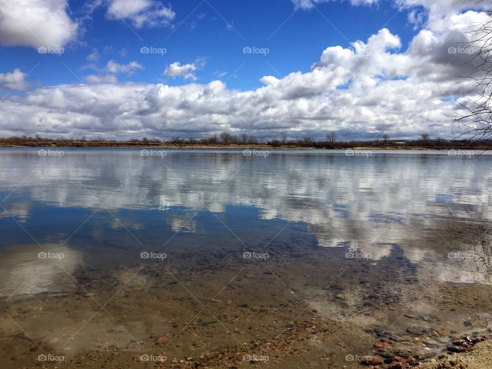 Cloud Reflections. Sky and clouds reflect in a small lake in Wyoming