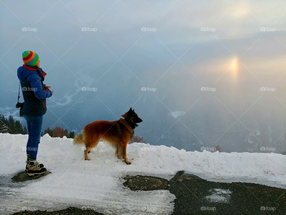 Max the dog with his owner looking at a sunset, La Rosière, La Plagne, Savoie, Alps, France