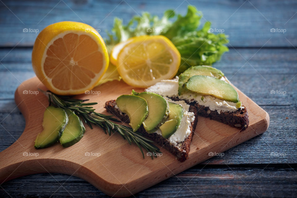 Dietary sandwiches with grain bread, cream cheese and avocado 