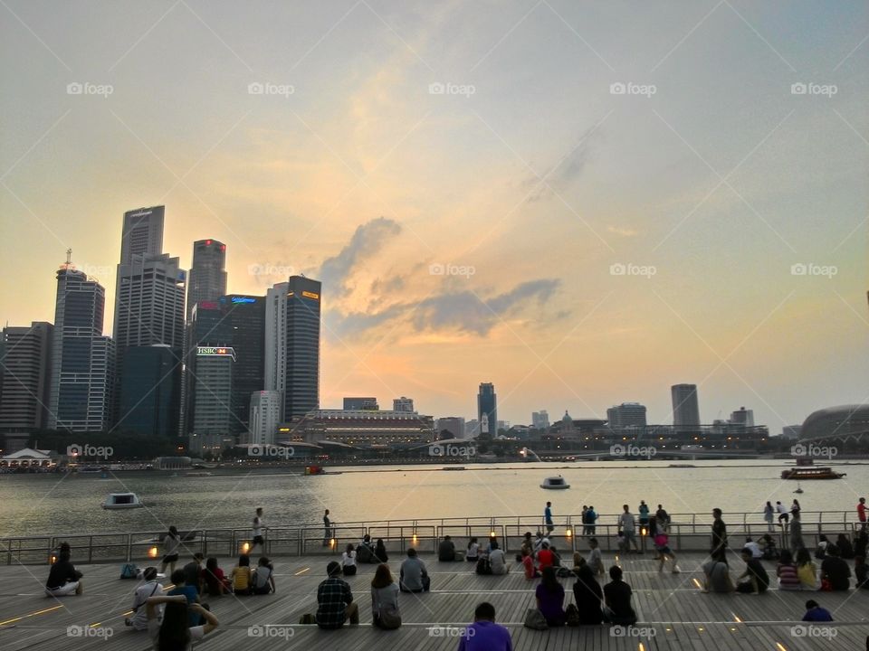 Sunset in Singapore city. Sunset in the crowd of the city