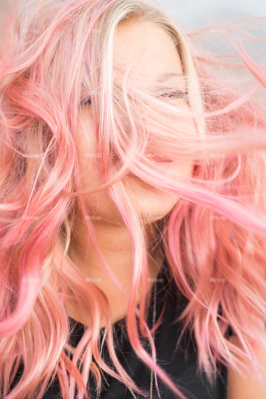 Close-up of a woman with pink hairs