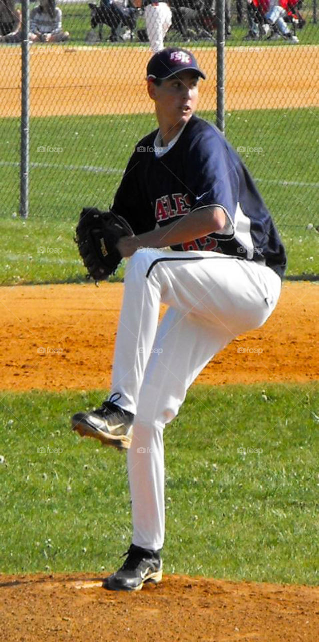 Baseball pitcher. 6 foot 8 right hand pitcher playing for his high school team