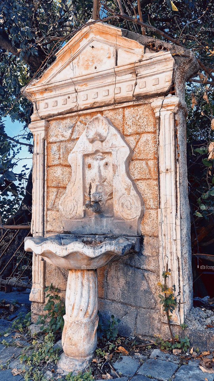Timeless Beauty: A Rustic Stone Fountain