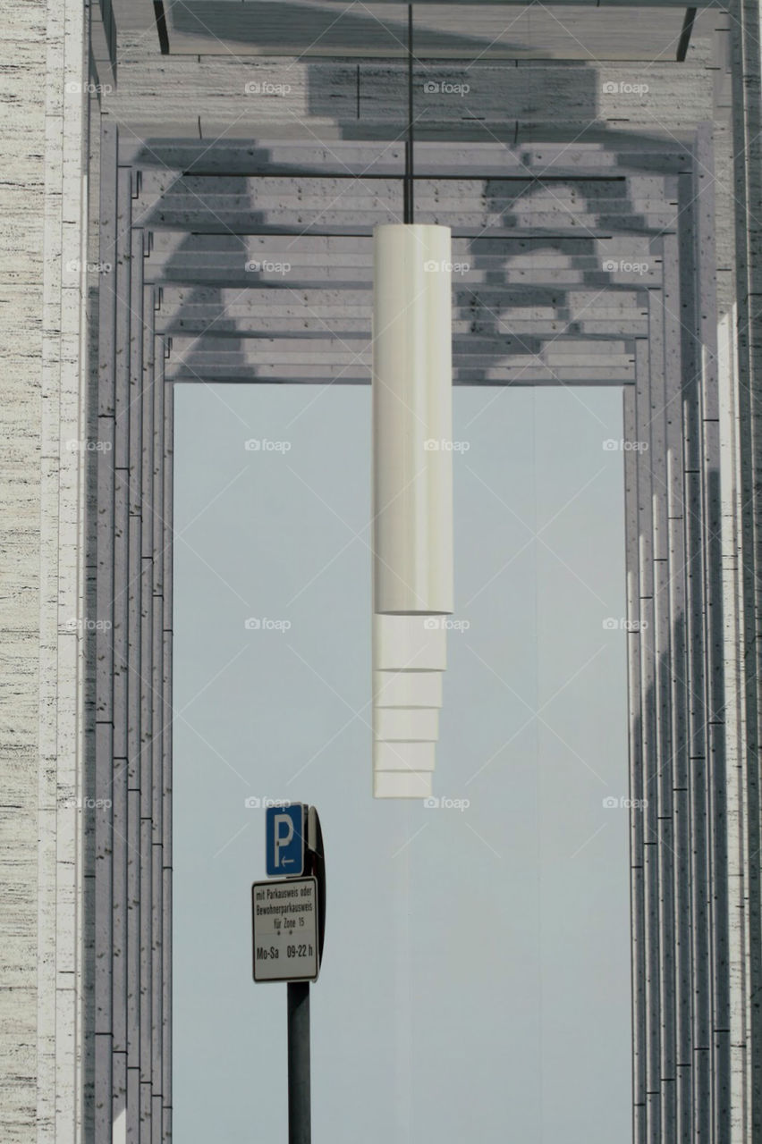 Real parking sign in front of a photo cover of a construction site