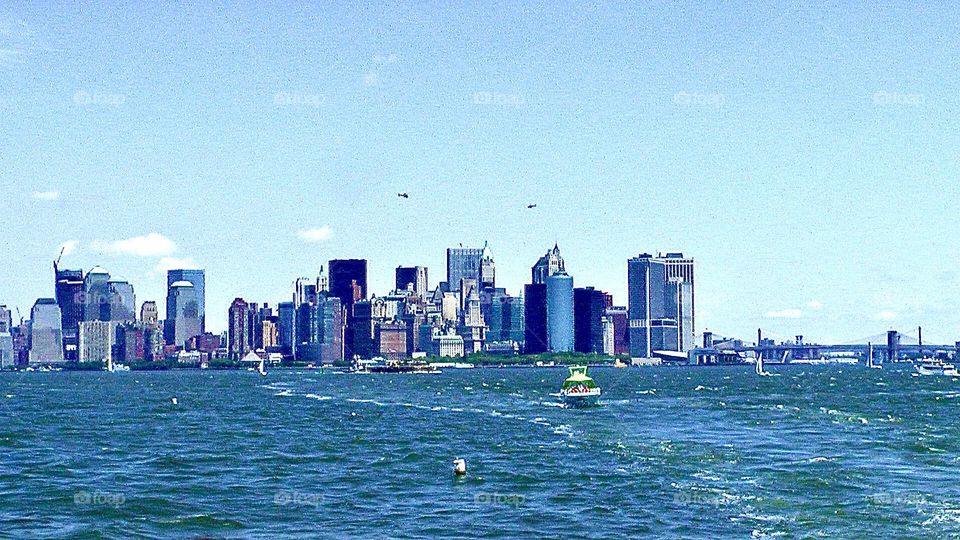 Ferry boat in New York Harbor near New York City skyline 