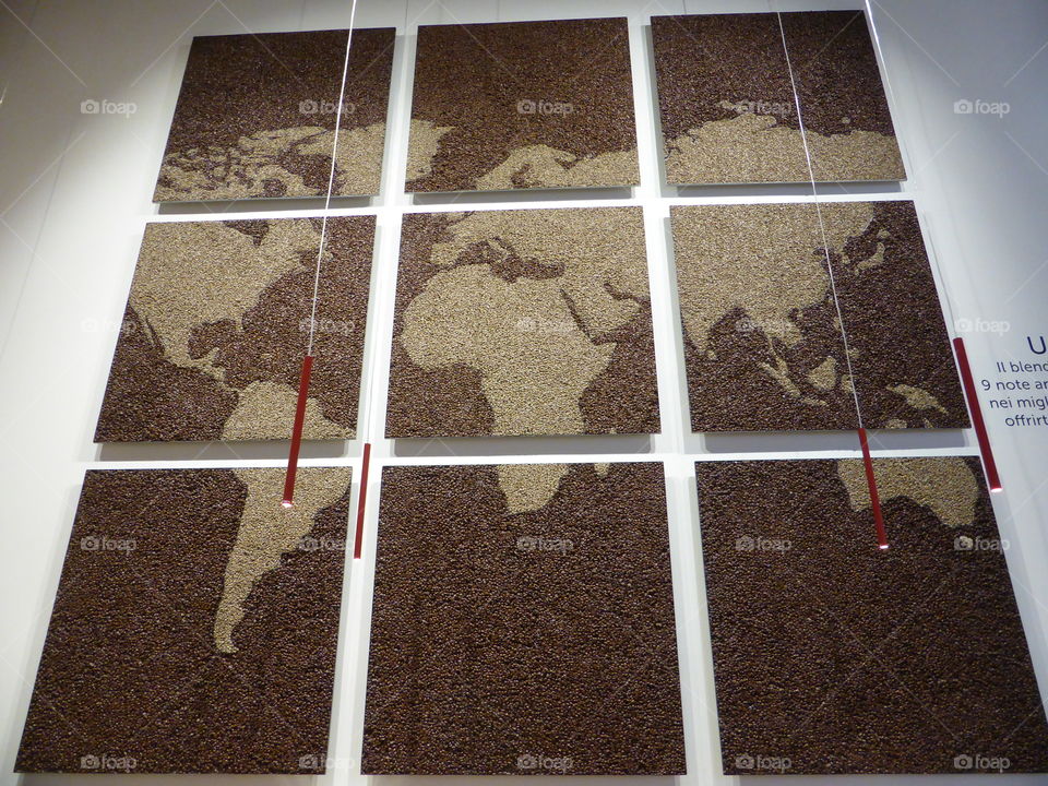 geographical map of tiles made of coffee beans in the cafe bar in Milan,Italy