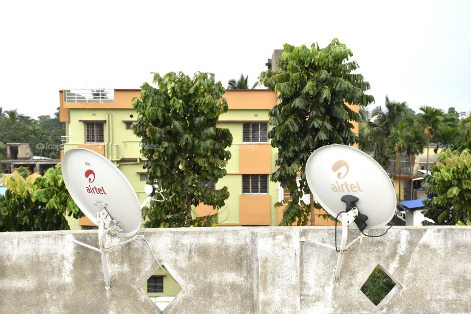 flat, trees & dish antenna.