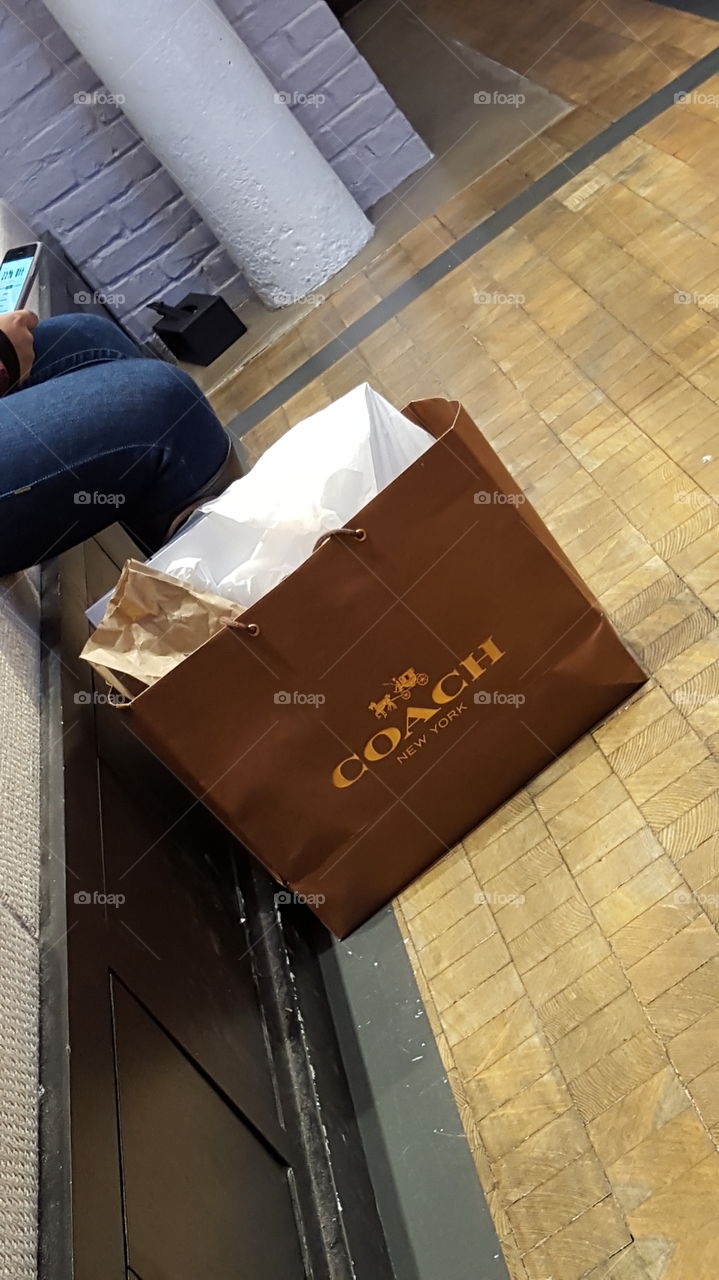 Coach shopping bag. shopping downtown Soho NYC