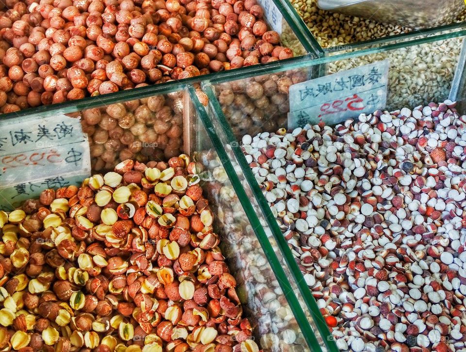Dried Seeds And Nuts In A Chinese Market. Dried Herbs And Nuts On Display In A Chinese Street Market
