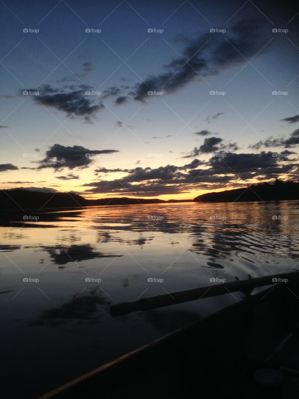 beautiful night in sweden out on a boat fishing.