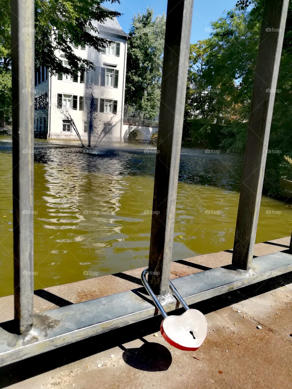 Shadow of a love lock in front of a castle