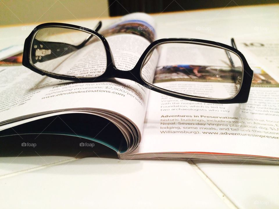 Glasses on a magazine