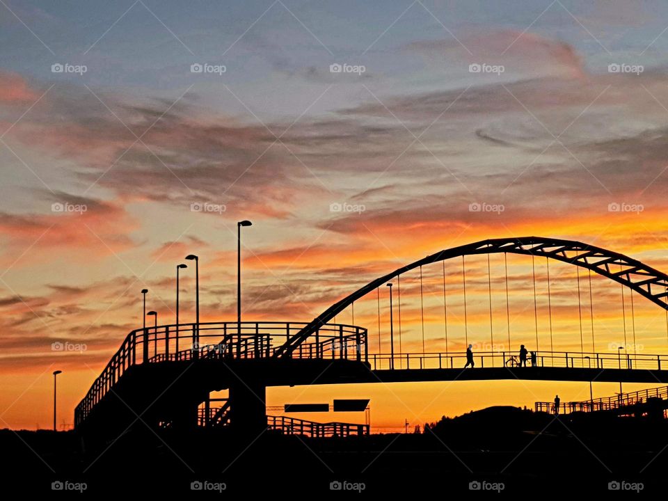 Amazing sunset view over the bridge on a warm summer evening.