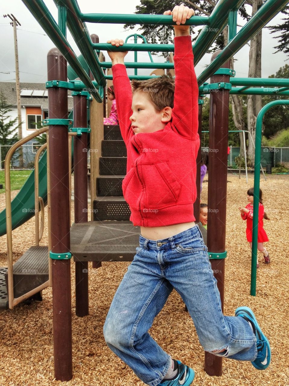 Boy Playing On A Jungle Gym
