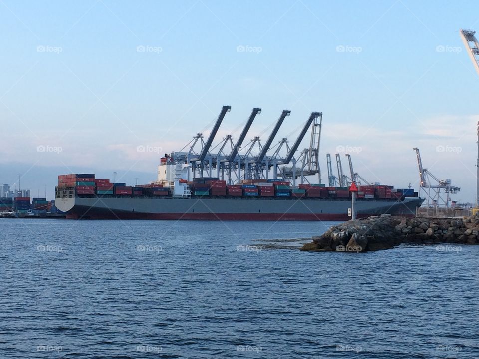 Port of Long Beach cargo ship and cranes 