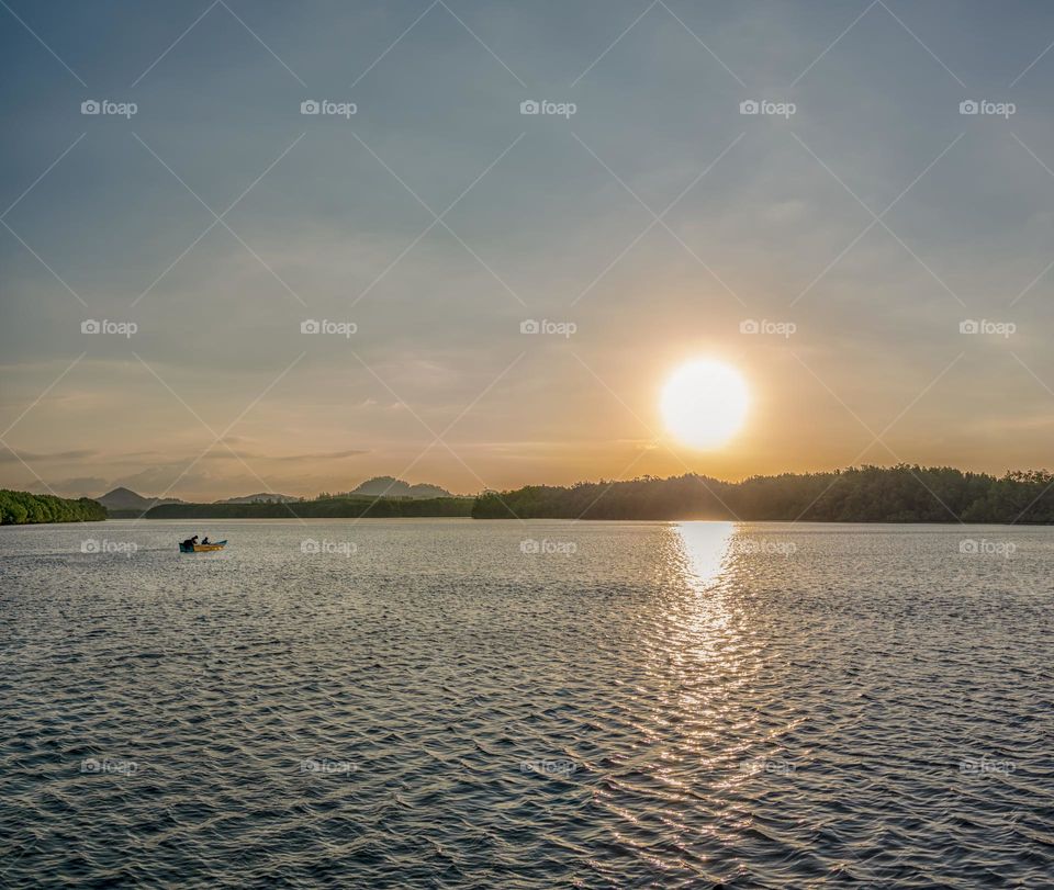 Boat and sea in sunset moment