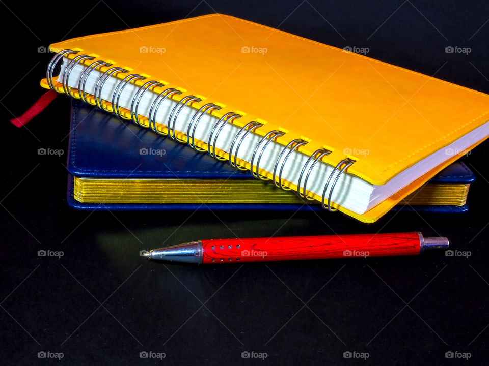 Everyday necessary set for a business man and a student of a schoolboy with pen notepad and notebook