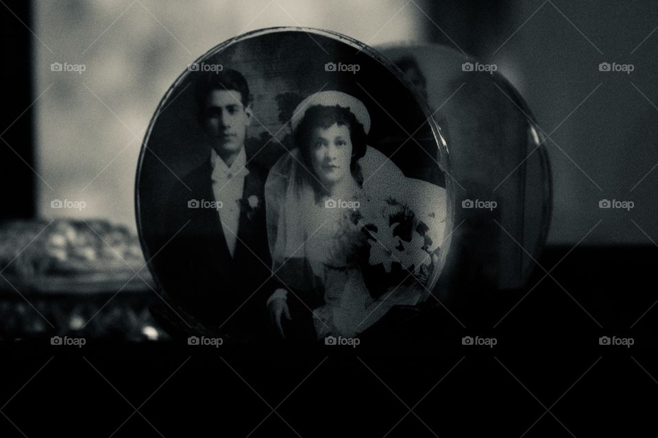 Vintage photo of a bride and groom in a round antique frame 