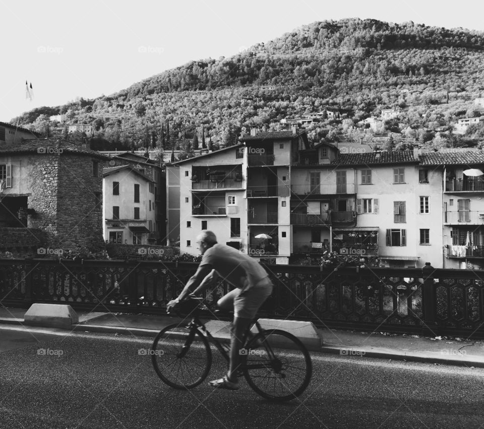 Guy on a bike in black and white 