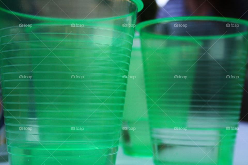 Close-up of green drinking glasses