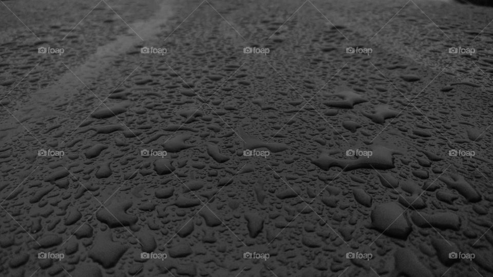 Elevated view of water drop of glass