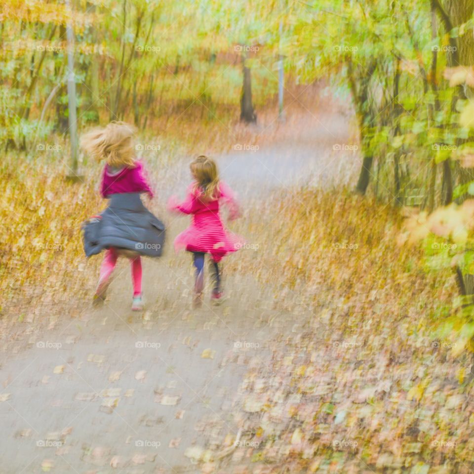 Small girls running and moving in the forest