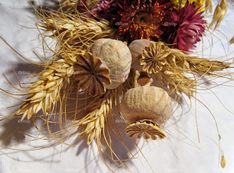 a bouquet of dried flowers and poppies on holiday