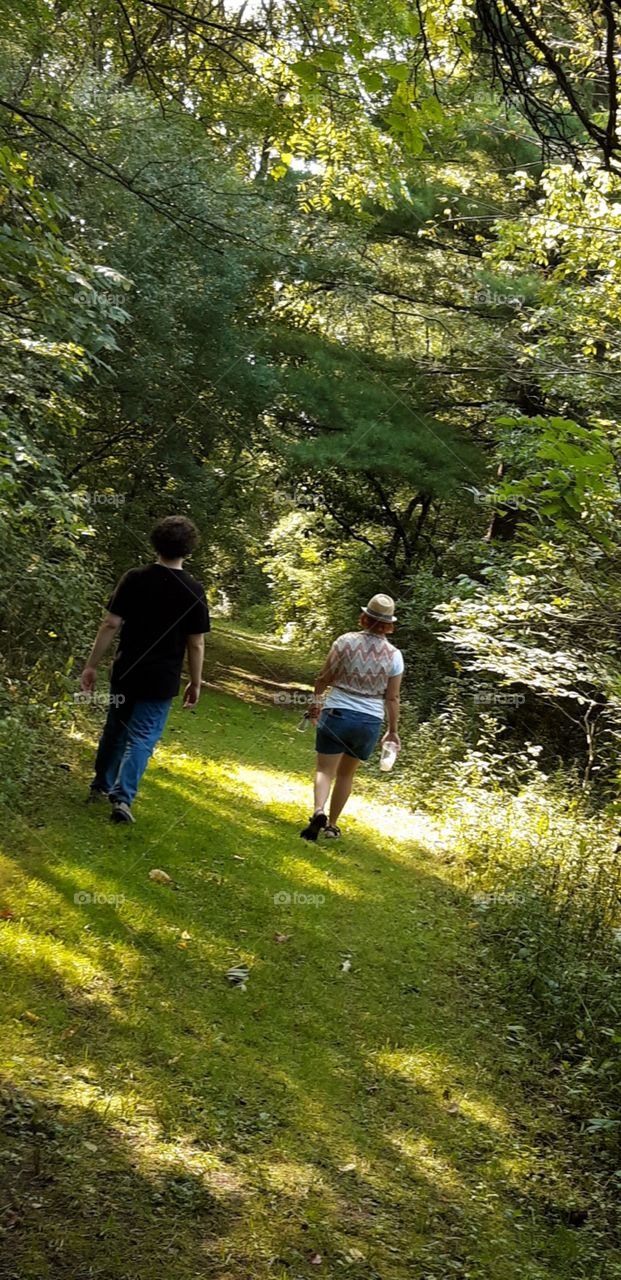 Mother and son take a walk in the woods. Teaching our kids how to respect and appreciate nature is so important! 