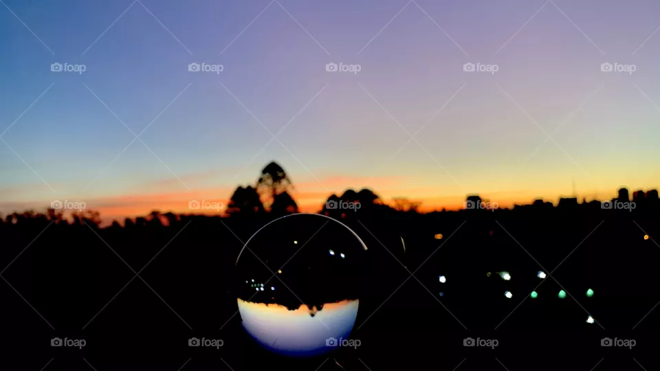 Sao Paulo, Brazil - April,2021: sunset view through a glass ball. 