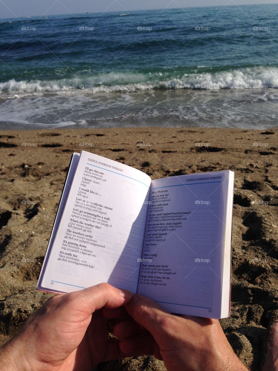 Learning some Spanish phrases on Benalmadina beach