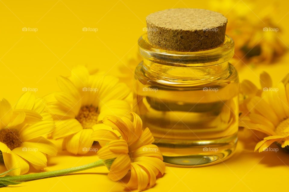 Calendula oil close up view . natural cosmetic concept