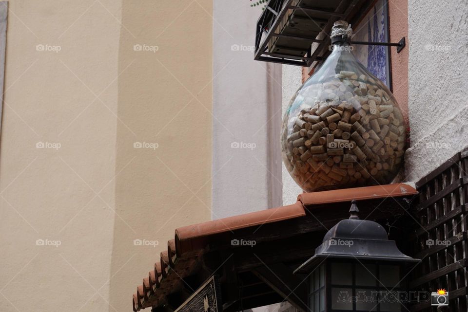 large glass jar with thousands of wine bottle corks