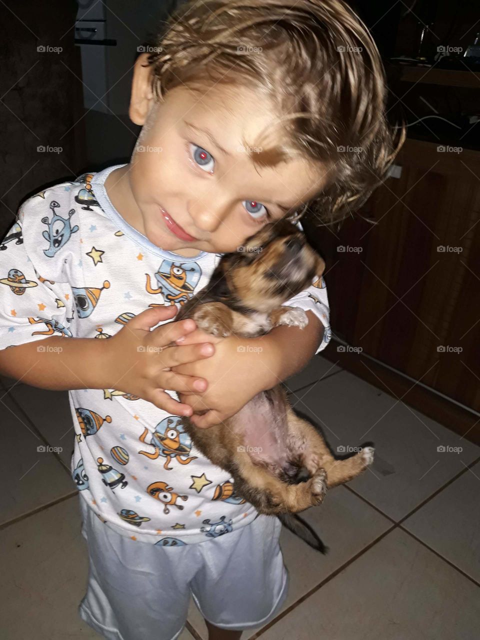 cheerful child playing with the dog