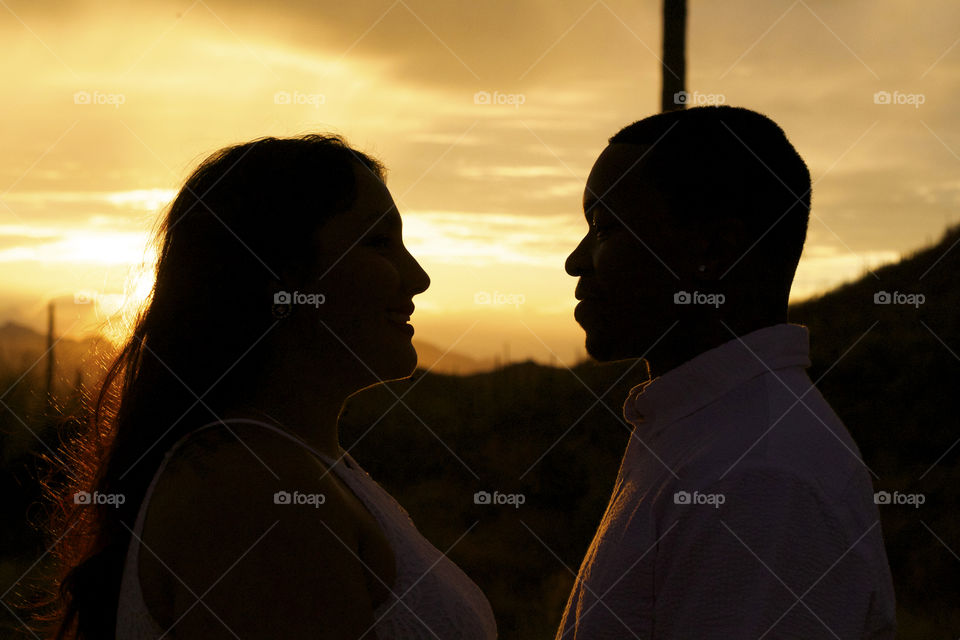 Silhouette of couple at sunset
