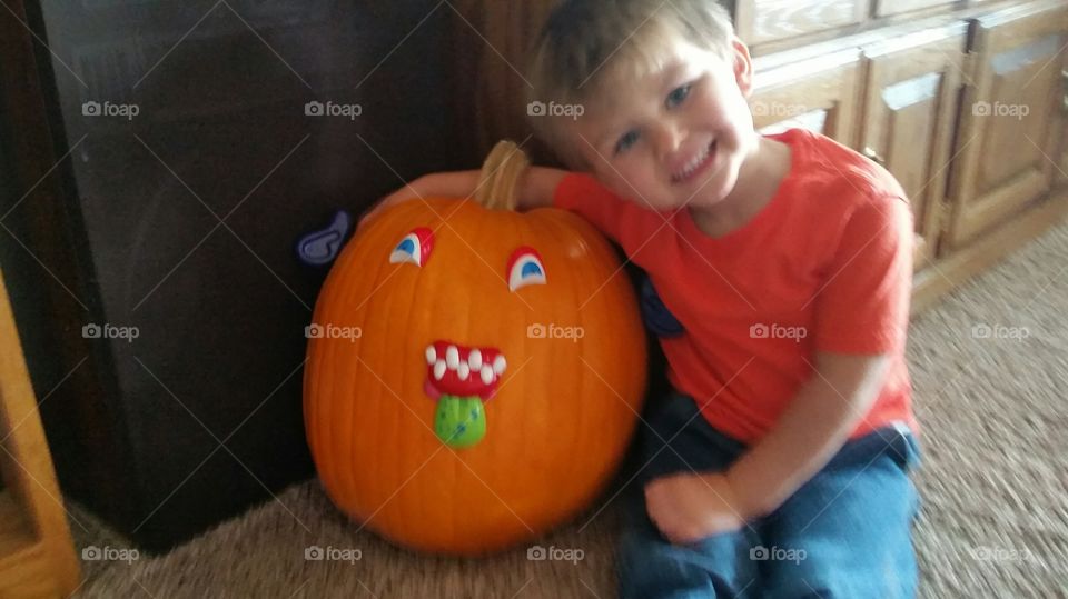 Boy with pumpkin
