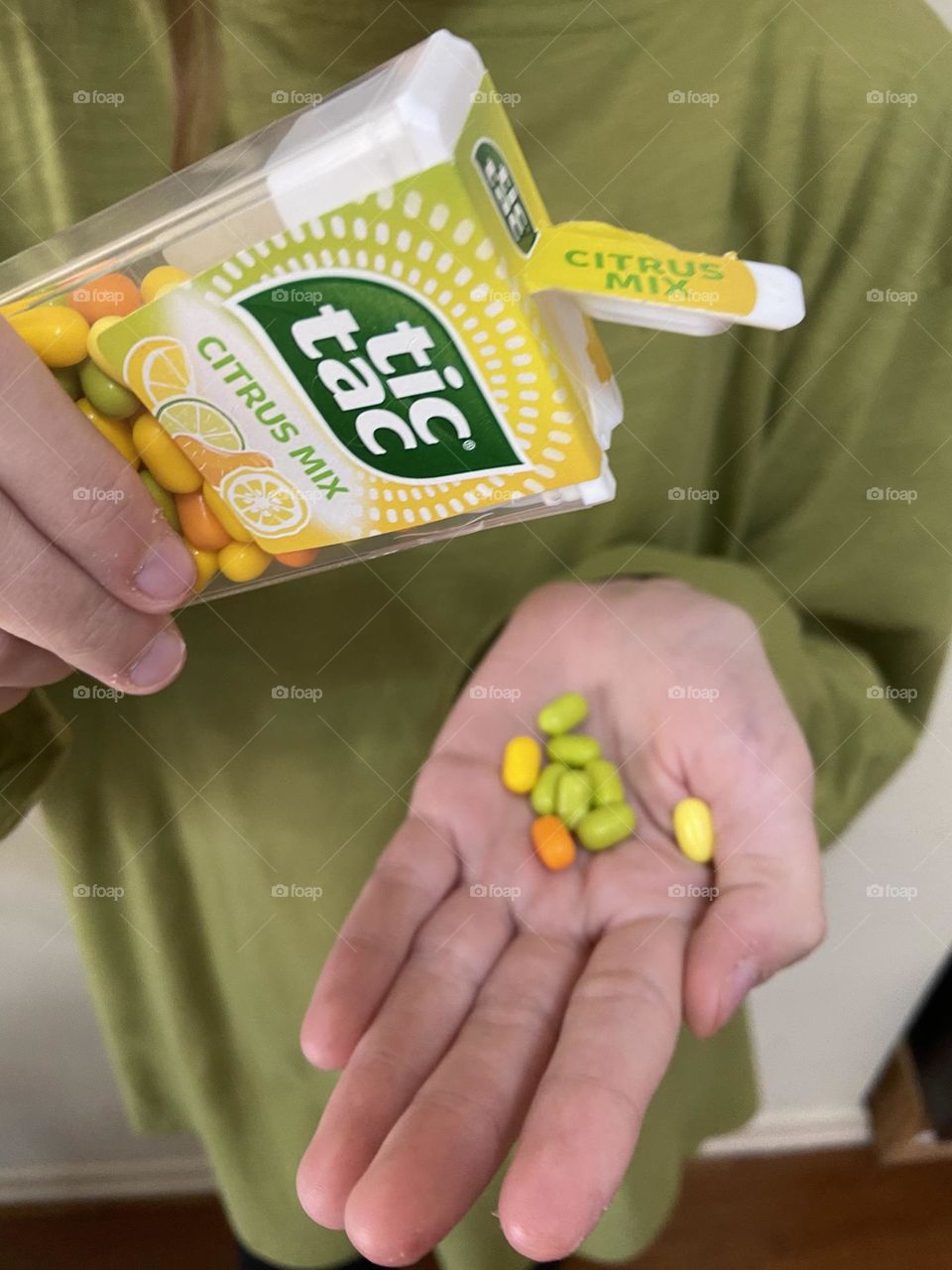 Little bursts of citrus flavors in yellow, orange, and green Tic Tac candy.