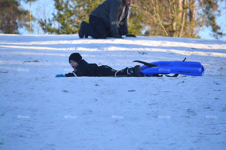 Boy has crashed with his sled