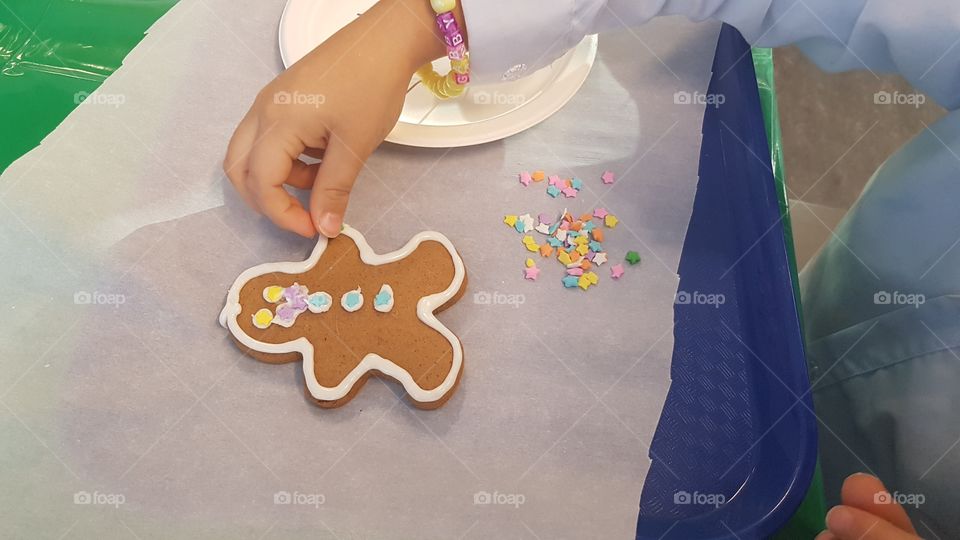 Decorating a gingerbread man